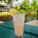 light pink drink with lime
