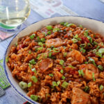 rice dish with seafood in a red sauce